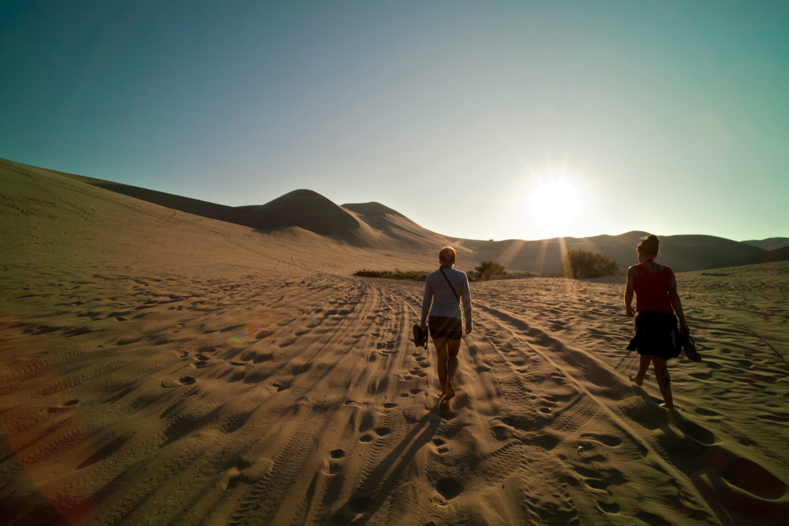 woman walking in sanddunes